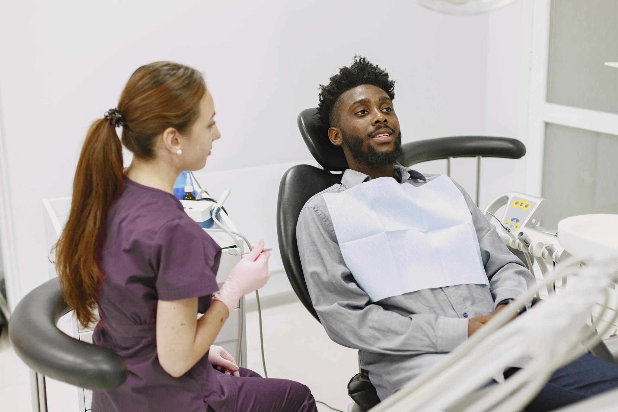 Patient receiving dental care during checkup visit at clinic.